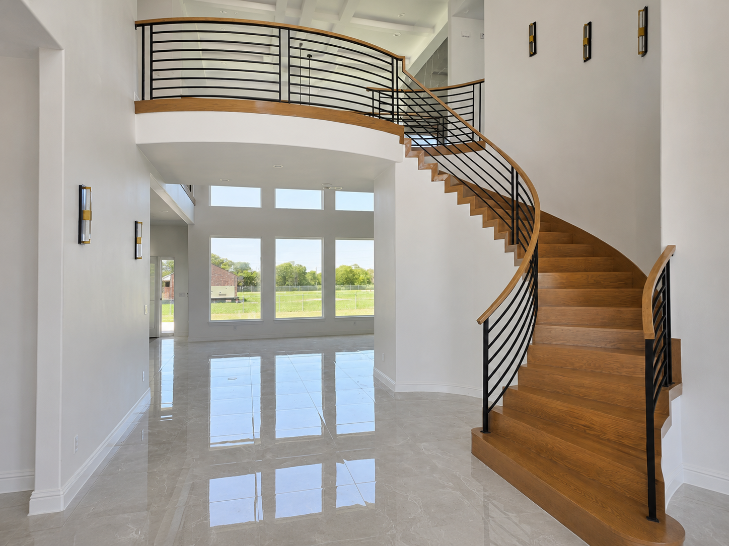Modern transitional staircase with dark railing and light walls