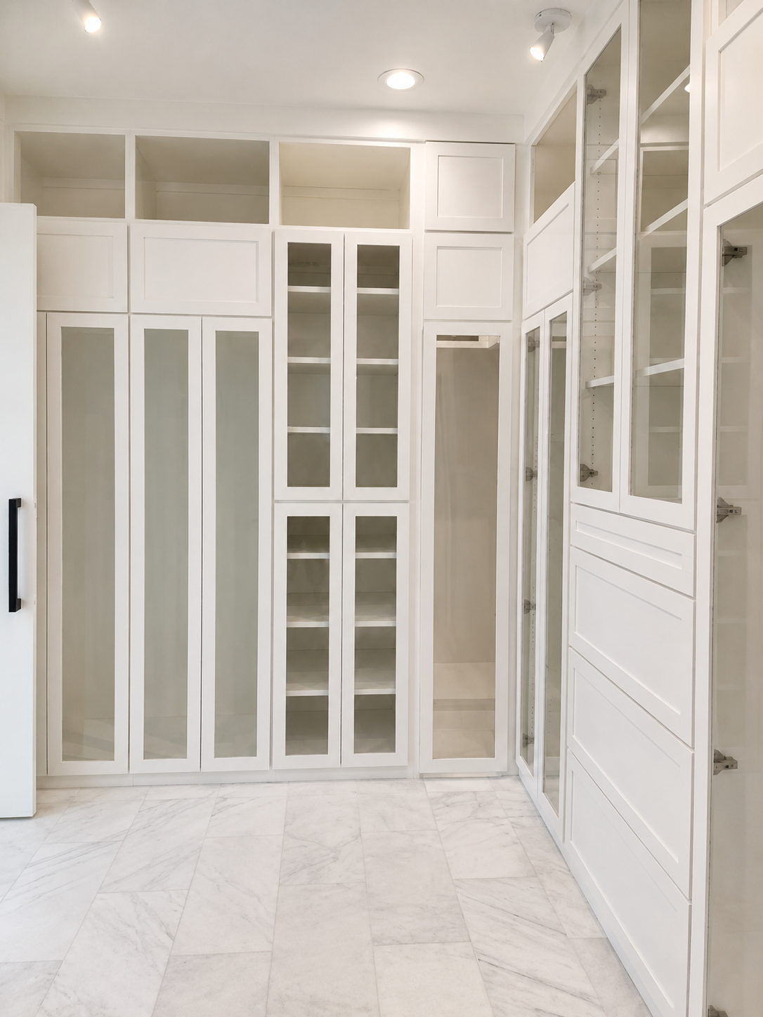 Custom closet with built-in shelving and hanging storage